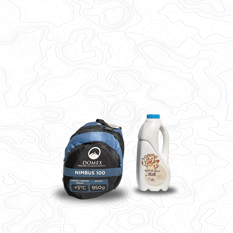 Scale image of Domex Nimbus 100 Summer Sleeping Bag - +5C, 950 g | On its side in stuff sack next to 1 L bottle of milk