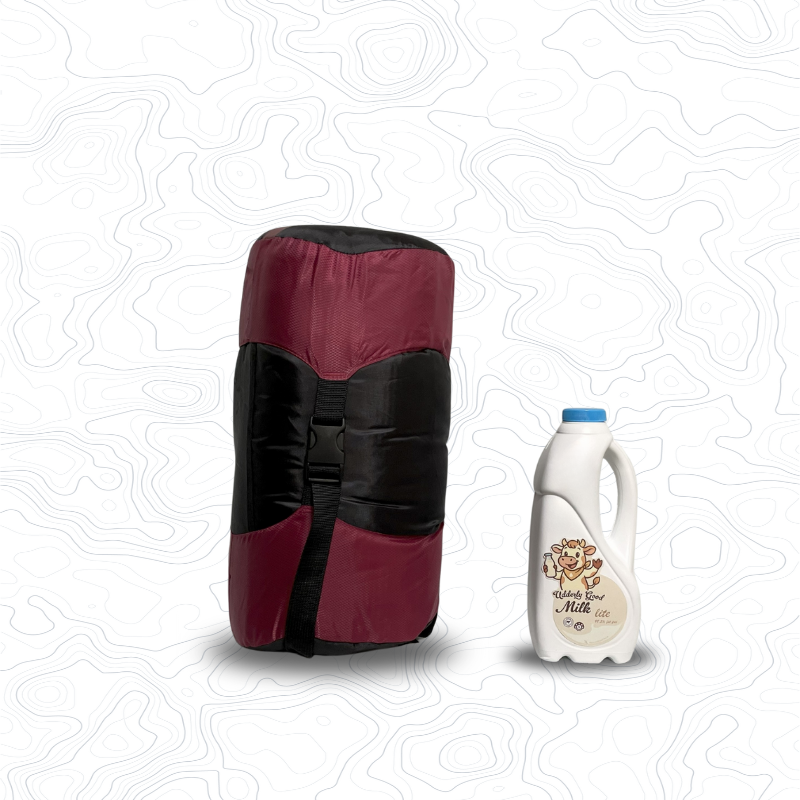 Scale image of Domex Nimbus 120 Sleeping Bag  | Upright in stuff sack next to 1 L bottle of milk
