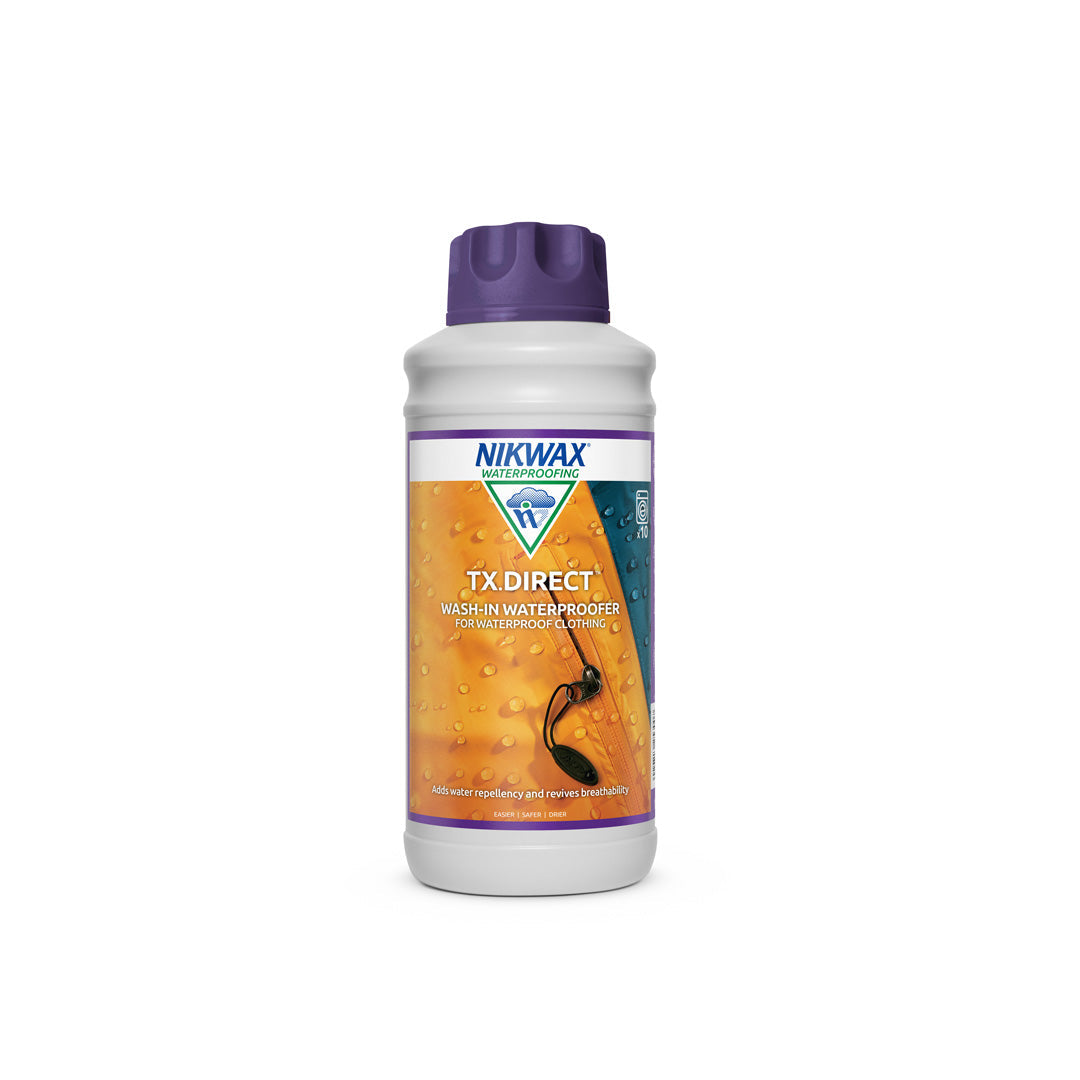 1 litre bottle of Nikwax TX Direct wash in. The bottle is white with purple lid and a label showing a close up of a yellow jacket with water beading on the surface | NW253