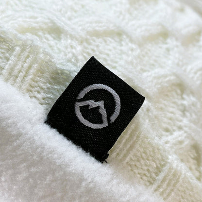 Close up of Domex logo on Honeycomb-knit cuffless beanie  - white | DOMB1065