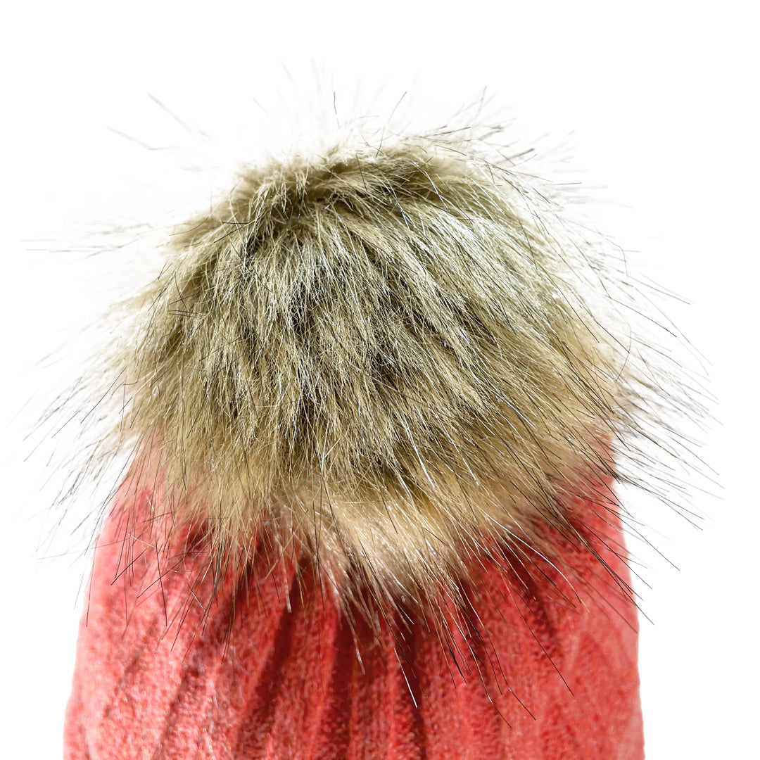 Close up of faux fur pom pom on Domex Pink thick rib-knit cuffed beanie 